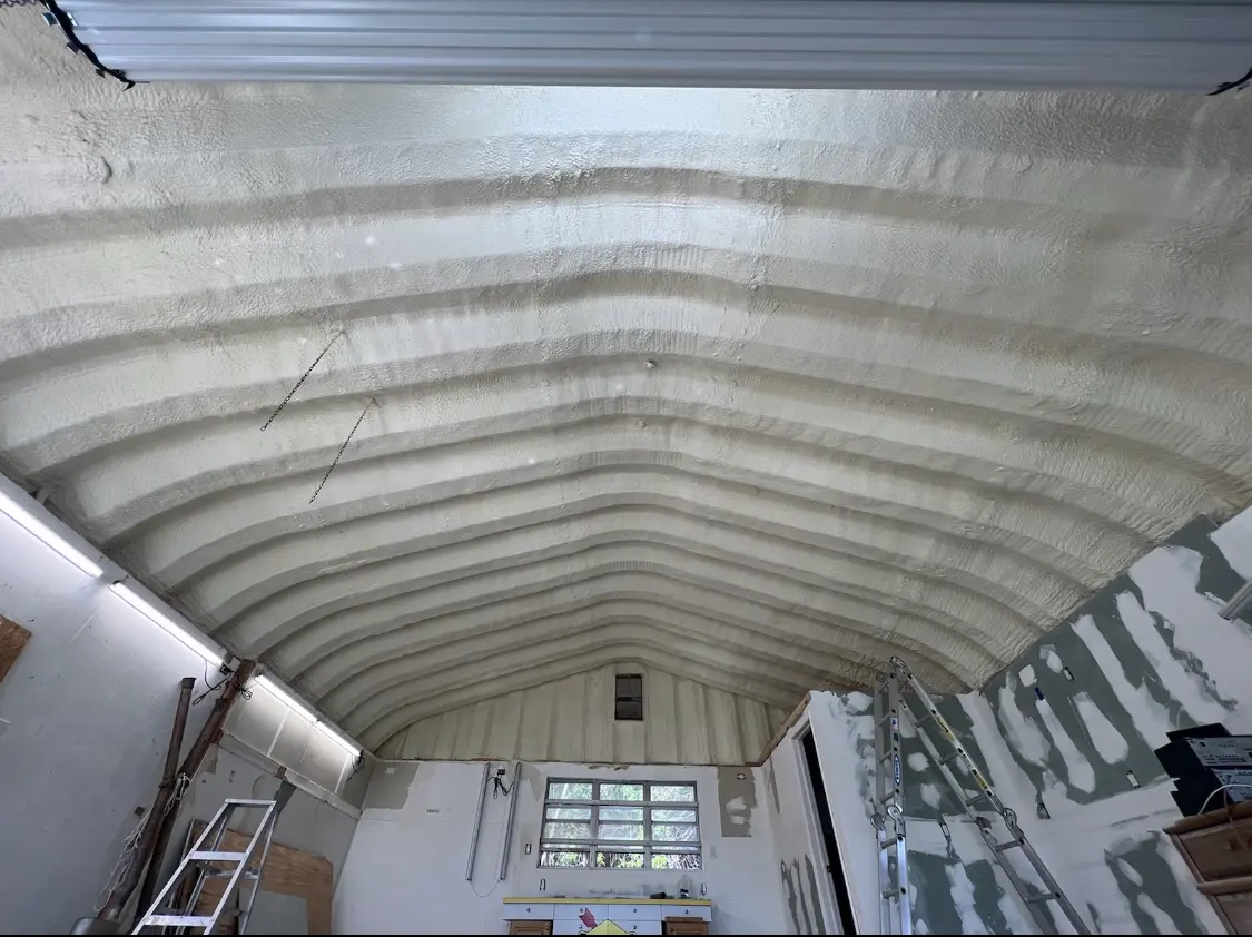 Spray polyurethane foam applied to the underside of a metal roof deck in Palisades Park